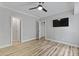Modern bedroom features light wood flooring, neutral walls, and a ceiling fan for added comfort at 800 Enclave Ter, Summerville, SC 29483