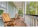 Inviting front porch with wood chairs and white railings at 800 Enclave Ter, Summerville, SC 29483