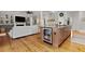 Kitchen island with beverage cooler and stools, seamlessly connects to the living area at 800 Enclave Ter, Summerville, SC 29483
