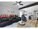 Cozy living room with home theatre seating, a coffee bar, wood beam, and ceiling fan at 800 Enclave Ter, Summerville, SC 29483