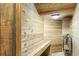 Inside view of home sauna featuring wood paneled walls and built-in wooden bench at 800 Enclave Ter, Summerville, SC 29483