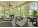 Inviting screened porch with comfortable seating and outdoor cooking equipment at 800 Enclave Ter, Summerville, SC 29483