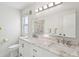 A recently remodeled bathroom features dual sinks, a marble counter top, and updated lighting at 801 Ventura Pl, Mount Pleasant, SC 29464