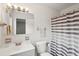 Bathroom featuring a shower with striped curtain, a toilet, and a sink and mirror at 801 Ventura Pl, Mount Pleasant, SC 29464