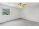 Bright bedroom with neutral carpet, a ceiling fan, and large window at 801 Ventura Pl, Mount Pleasant, SC 29464