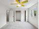 Bright bedroom with neutral carpet, a large window, and a ceiling fan with yellow blades at 801 Ventura Pl, Mount Pleasant, SC 29464
