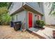 Exterior view of townhome featuring a red front door and landscaped front at 801 Ventura Pl, Mount Pleasant, SC 29464