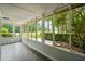 Screened porch offers serene golf course views, providing a perfect blend of indoor-outdoor living and natural beauty at 801 Ventura Pl, Mount Pleasant, SC 29464