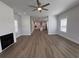Open-concept living room with fireplace flowing into a modern kitchen at 819 Burger St, Charleston, SC 29407