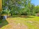 Backyard with a beautiful view of a deck, lush greenery, and large trees for shade at 840 Brittle Bank Rd, Walterboro, SC 29488