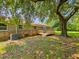 Brick home with a charming wooden deck, beautiful trees, and well-maintained greenery in the backyard at 840 Brittle Bank Rd, Walterboro, SC 29488