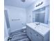 Bathroom with modern vanity, large mirror, and gray marbled floors at 840 Brittle Bank Rd, Walterboro, SC 29488