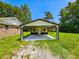 Detached garage with a modern design that includes a concrete floor and ample parking space at 840 Brittle Bank Rd, Walterboro, SC 29488
