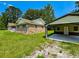 Brick home and a detached garage featuring modern design with ample parking in a well-maintained yard at 840 Brittle Bank Rd, Walterboro, SC 29488