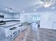 Charming kitchen with stainless steel appliances, kitchen island, and view into the living room at 840 Brittle Bank Rd, Walterboro, SC 29488