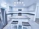 Cozy kitchen with an island, stainless appliances, granite countertops, and white cabinets at 840 Brittle Bank Rd, Walterboro, SC 29488