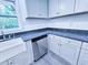 Features new stainless steel dishwasher, farmhouse sink, stone countertops and gray cabinets at 840 Brittle Bank Rd, Walterboro, SC 29488