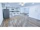 Charming kitchen with stainless steel appliances, kitchen island, and view into the living room at 840 Brittle Bank Rd, Walterboro, SC 29488