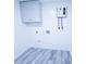 Bright laundry room features new water heater, modern flooring and neutral paint at 840 Brittle Bank Rd, Walterboro, SC 29488