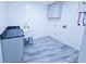 Utility room features a new utility sink, stone countertop and washer and dryer hookups at 840 Brittle Bank Rd, Walterboro, SC 29488
