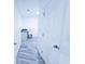Hallway leading to utility room with new washer-dryer hookups and a utility sink at 840 Brittle Bank Rd, Walterboro, SC 29488
