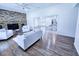 Bright living room with fireplace and hardwood floors flows into an open kitchen with a breakfast bar at 840 Brittle Bank Rd, Walterboro, SC 29488