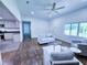 Bright living room with open concept showcases the nearby eat-in kitchen and hardwood floors at 840 Brittle Bank Rd, Walterboro, SC 29488