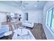 Sunlit living room with an open floor plan features hardwood floors, fireplace and kitchen at 840 Brittle Bank Rd, Walterboro, SC 29488