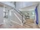 Open foyer with a staircase, wood floors, and view into other rooms at 100 Hunters Wood Dr, Summerville, SC 29485