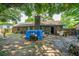 Backyard with a brick house, chimney, and a blue tarp at 1004 Miles Jamison Rd, Summerville, SC 29485