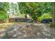 Backyard with a brick house and a large tree at 1004 Miles Jamison Rd, Summerville, SC 29485