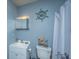 Bathroom with a vanity, toilet, and shower with nautical decor at 1004 Miles Jamison Rd, Summerville, SC 29485
