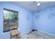 Bedroom with blue walls, one window and a chair at 1004 Miles Jamison Rd, Summerville, SC 29485