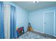 A bedroom with light blue walls, carpet floors and a closed door at 1004 Miles Jamison Rd, Summerville, SC 29485