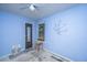 Bedroom featuring blue walls, a window, a door, and decorative wall art at 1004 Miles Jamison Rd, Summerville, SC 29485