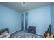 This bedroom features blue walls and a window letting in natural light at 1004 Miles Jamison Rd, Summerville, SC 29485