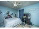 Bedroom with blue walls, a bed, vanity, and a ceiling fan at 1004 Miles Jamison Rd, Summerville, SC 29485