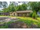 Charming single story home featuring mixed siding and a lush, landscaped front yard at 1004 Miles Jamison Rd, Summerville, SC 29485