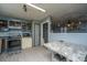 This kitchen includes an oven, refrigerator and an adjoining living space at 1004 Miles Jamison Rd, Summerville, SC 29485