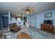 Spacious living room featuring wood floors, fan and an open view to the kitchen at 1004 Miles Jamison Rd, Summerville, SC 29485