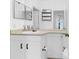 Bright bathroom with a large mirror, and a clean, white vanity and cabinets at 1014 Rosewood Ln, Mount Pleasant, SC 29464