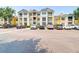 Exterior view of condo building with a parking lot filled with cars at 1014 Rosewood Ln, Mount Pleasant, SC 29464