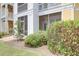 The back of a yellow house, with a screened-in porch, surrounded by lush landscaping at 1014 Rosewood Ln, Mount Pleasant, SC 29464