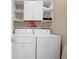 Practical laundry area with modern washer and dryer, and plenty of storage space with upper cabinets at 1014 Rosewood Ln, Mount Pleasant, SC 29464
