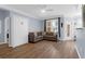 Cozy living room featuring a Murphy bed, modern furniture, and lots of light at 1014 Rosewood Ln, Mount Pleasant, SC 29464