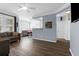 An open-concept living room with a modern ceiling fan and light blue walls at 1014 Rosewood Ln, Mount Pleasant, SC 29464