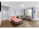 Cozy living space with sleeper couch, plank flooring, a ceiling fan, and natural light coming through large windows at 1014 Rosewood Ln, Mount Pleasant, SC 29464