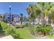 Community pool and amenity area with palm trees, lounge chairs, and well-maintained landscaping at 1014 Rosewood Ln, Mount Pleasant, SC 29464