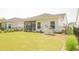 Expansive backyard featuring lush green grass, a screened porch, a fenced yard, and a Generac generator at 1030 Grace Field Ave, Summerville, SC 29485