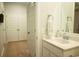 Well-lit bathroom featuring a vanity, sink, mirror, and a view of the closet at 1030 Grace Field Ave, Summerville, SC 29485